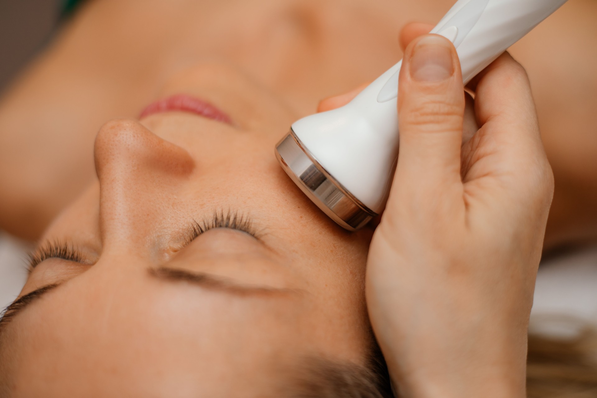 Woman get facial hydro microderm abrasion peeling treatment therapy. Cosmetic beauty Spa salon. Hydra Vacuum Cleaner